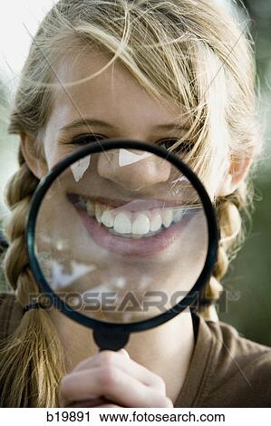 girl with a magnifying glass View Large Photo Image Stock Image - girl with a magnifying glass. Fotosearch