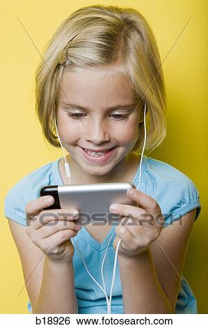 girl with an iPhone. View Large Photo Image Stock Photograph - girl with an iPhone.. Fotosearch