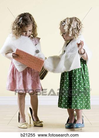 Stock Photography - girls playing dress up. Fotosearch