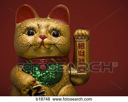 Stock Photo - Golden asian cat toy.. Fotosearch