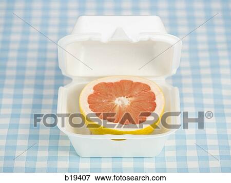 Stock Photo - grapefruit in a fast food container. Fotosearch