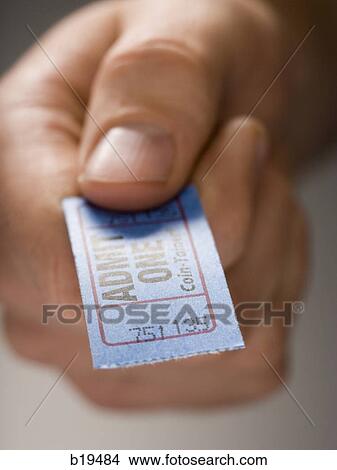 Picture - hand holding a ticket. Fotosearch