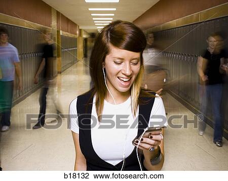 High School girl at school listening to MP3 player. View Large Photo Image Stock Image - High School girl at school listening to MP3 player.. Fotosearch