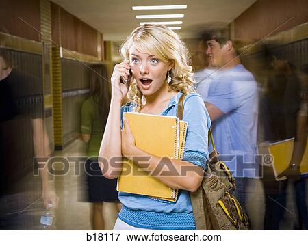 High School girl at school on mobile phone. View Large Photo Image Stock Photo - High School girl at school on mobile phone.. Fotosearch