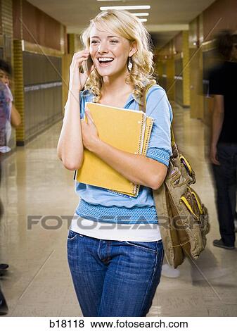 High School girl at school on mobile phone. View Large Photo Image Stock Photo - High School girl at school on mobile phone.. Fotosearch