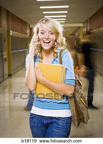 High School girl at school on mobile phone. View Large Photo Image Stock Photo - High School girl at school on mobile phone.. Fotosearch