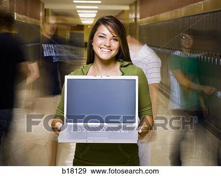 High School girl at school with a notebook computer. View Large Photo Image Stock Photo - High School girl at school with a notebook computer.. Fotosearch