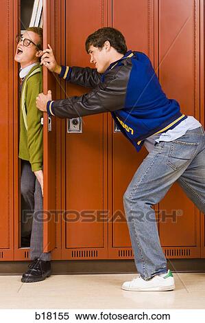 High school jock pushing nerd in locker. View Large Photo Image Stock Photography - High school jock pushing nerd in locker.. Fotosearch