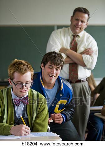 High school teacher catching high school jock cheating. View Large Photo Image Picture - High school teacher catching high school jock cheating.. Fotosearch