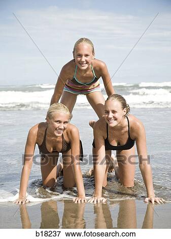 Human pyramid on the beach. View Large Photo Image Stock Photo - Human pyramid on the beach.. Fotosearch
