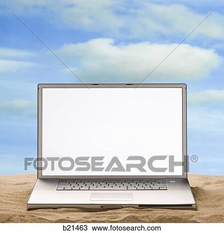 Stock Image - laptop in the sand. Fotosearch