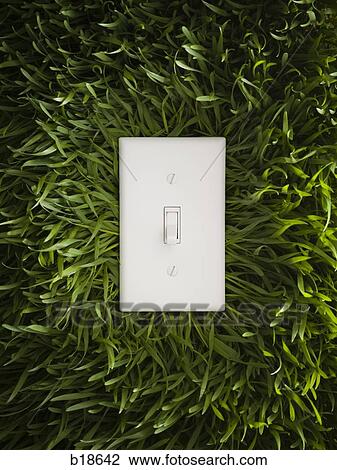 Light switch on green grass. View Large Photo Image Stock Image - Light switch on green grass.. Fotosearch