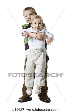 little boy holding a little girl View Large Photo Image Stock Photo - little boy holding a little girl. Fotosearch