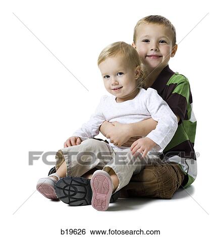 little boy holding a little girl View Large Photo Image Stock Photograph - little boy holding a little girl. Fotosearch