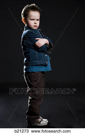 Stock Image - little boy in a jean jacket. Fotosearch