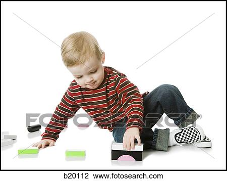 little boy playing with toys View Large Photo Image Stock Image - little boy playing with toys. Fotosearch