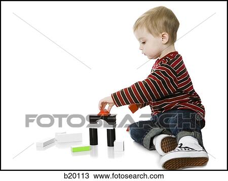little boy playing with toys View Large Photo Image Stock Image - little boy playing with toys. Fotosearch