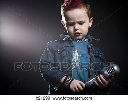 little boy singing into a microphone View Large Photo Image Stock Photo - little boy singing into a microphone. Fotosearch
