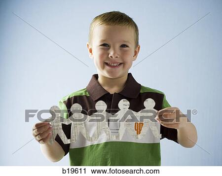 little boy with a paper cutout View Large Photo Image Stock Image - little boy with a paper cutout. Fotosearch
