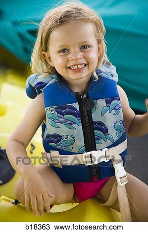 Little girl in a swimsuit. View Large Photo Image Stock Image - Little girl in a swimsuit.. Fotosearch