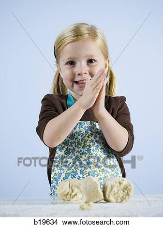 little girl kneading dough View Large Photo Image Picture - little girl kneading dough. Fotosearch