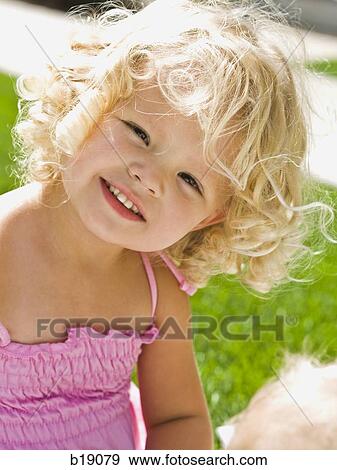 little girl on the grass. View Large Photo Image Stock Photo - little girl on the grass.. Fotosearch