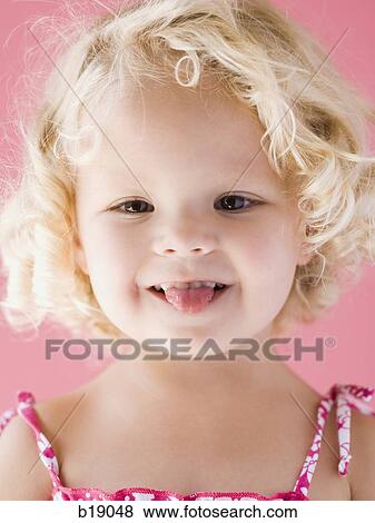 little girl sticking her tongue out. View Large Photo Image Stock Photo - little girl sticking her tongue out.. Fotosearch