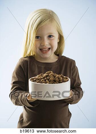 little girl with a bowl of dog food View Large Photo Image Stock Image - little girl with a bowl of dog food. Fotosearch