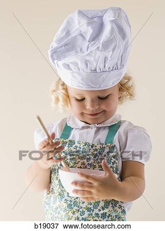 little girl with a chef's hat on. View Large Photo Image Stock Photo - little girl with a chef's hat on.. Fotosearch