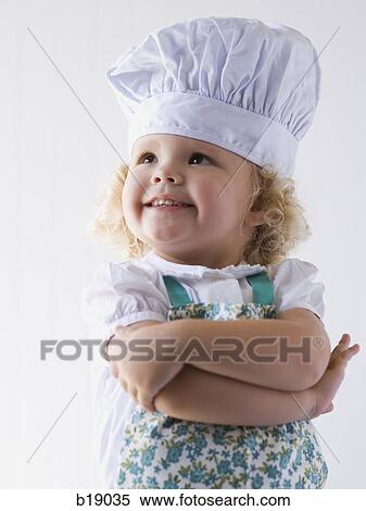 little girl with a chef's hat on. View Large Photo Image Stock Photography - little girl with a chef's hat on.. Fotosearch