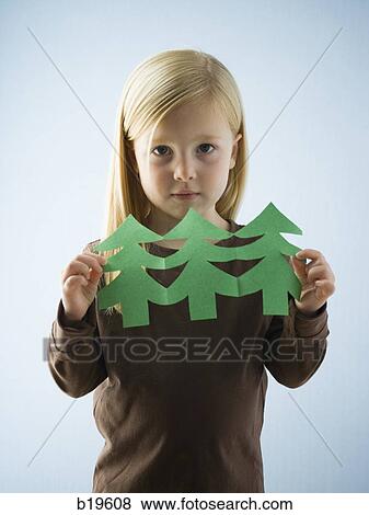 Stock Photo - little girl with a paper cutout. Fotosearch
