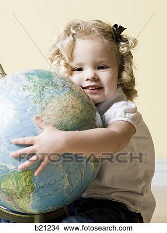 little girl with globe View Large Photo Image Picture - little girl with globe. Fotosearch