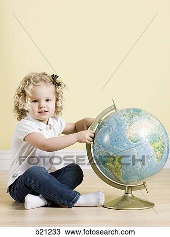 little girl with globe View Large Photo Image Stock Image - little girl with globe. Fotosearch