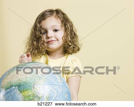 little girl with globe View Large Photo Image Stock Photo - little girl with globe. Fotosearch