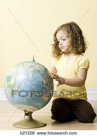 little girl with globe View Large Photo Image Stock Photo - little girl with globe. Fotosearch