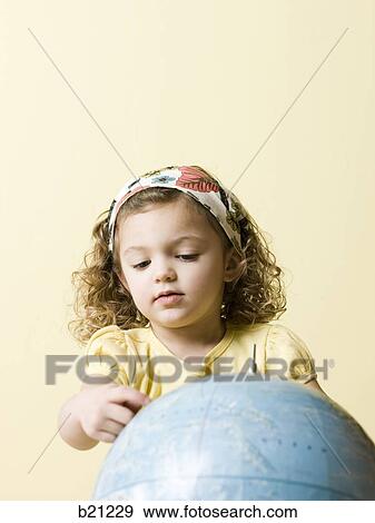 little girl with globe View Large Photo Image Stock Photo - little girl with globe. Fotosearch