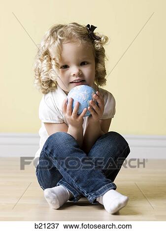 little girl with globe View Large Photo Image Stock Photo - little girl with globe. Fotosearch