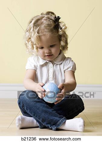 little girl with globe View Large Photo Image Stock Photograph - little girl with globe. Fotosearch