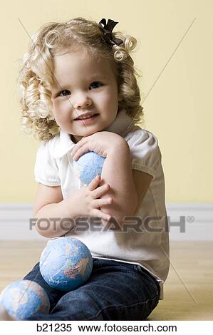 little girl with globe View Large Photo Image Stock Photography - little girl with globe. Fotosearch