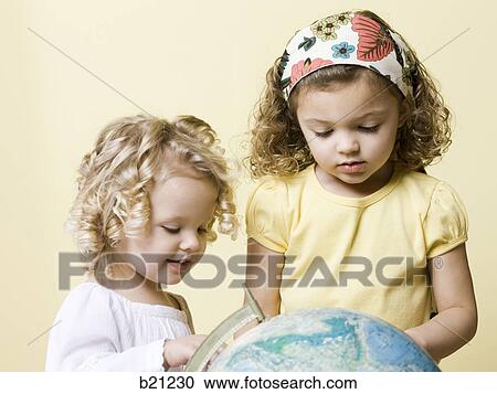 little girls with globe View Large Photo Image Stock Image - little girls with globe. Fotosearch