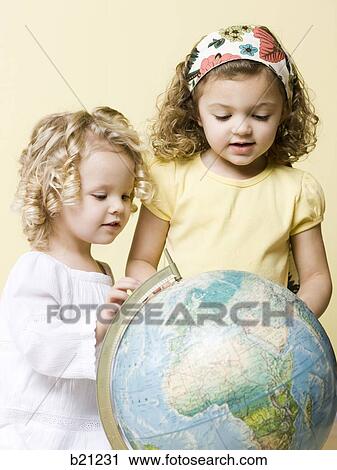 little girls with globe View Large Photo Image Stock Image - little girls with globe. Fotosearch