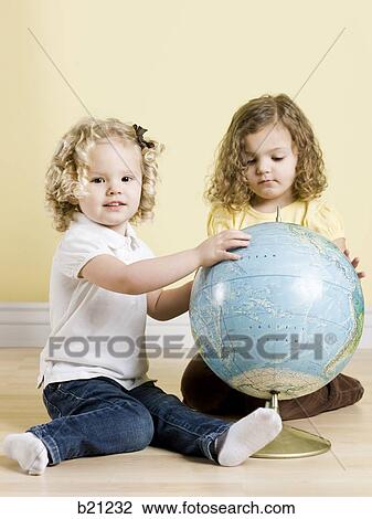 little girls with globe View Large Photo Image Stock Image - little girls with globe. Fotosearch