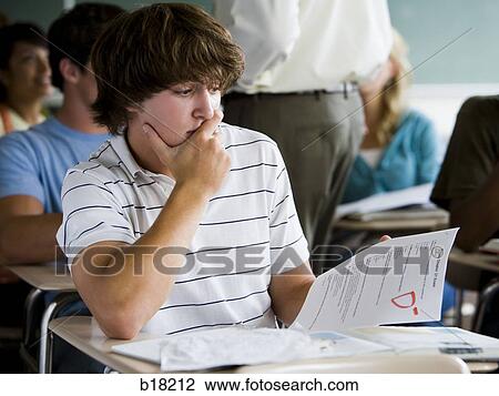 Male student in a classroom. View Large Photo Image Stock Image - Male student in a classroom.. Fotosearch