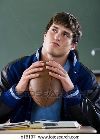 Stock Photo - Male student in a classroom.. Fotosearch
