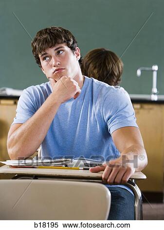 Male student in a classroom. View Large Photo Image Stock Photography - Male student in a classroom.. Fotosearch