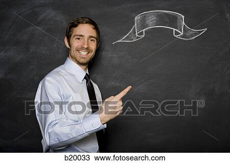 man against a blackboard View Large Photo Image Stock Image - man against a blackboard. Fotosearch