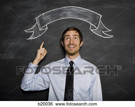 man against a blackboard View Large Photo Image Stock Photograph - man against a blackboard. Fotosearch