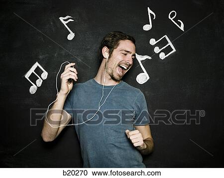 Stock Image - man against a chalkboard. Fotosearch