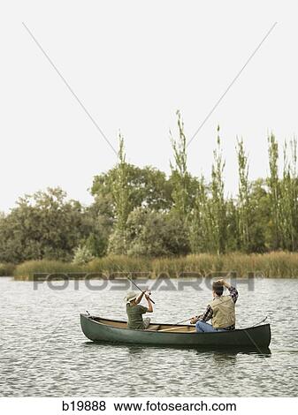 man and boy fishing on a lake View Large Photo Image Stock Photo - man and boy fishing on a lake. Fotosearch