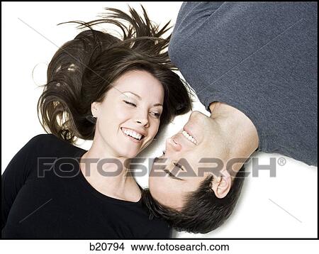 man and woman lying head to head View Large Photo Image Picture - man and woman lying head to head. Fotosearch
